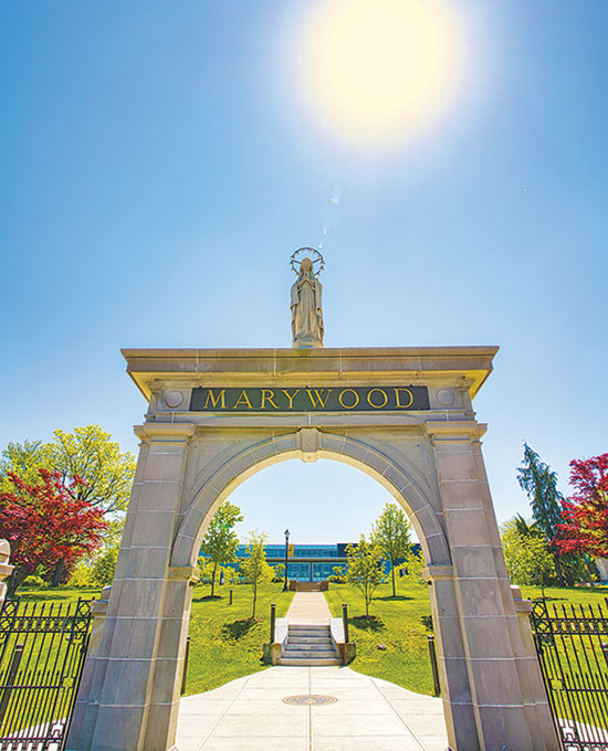 St. Mary's arch at the front of campus with Her on top and 